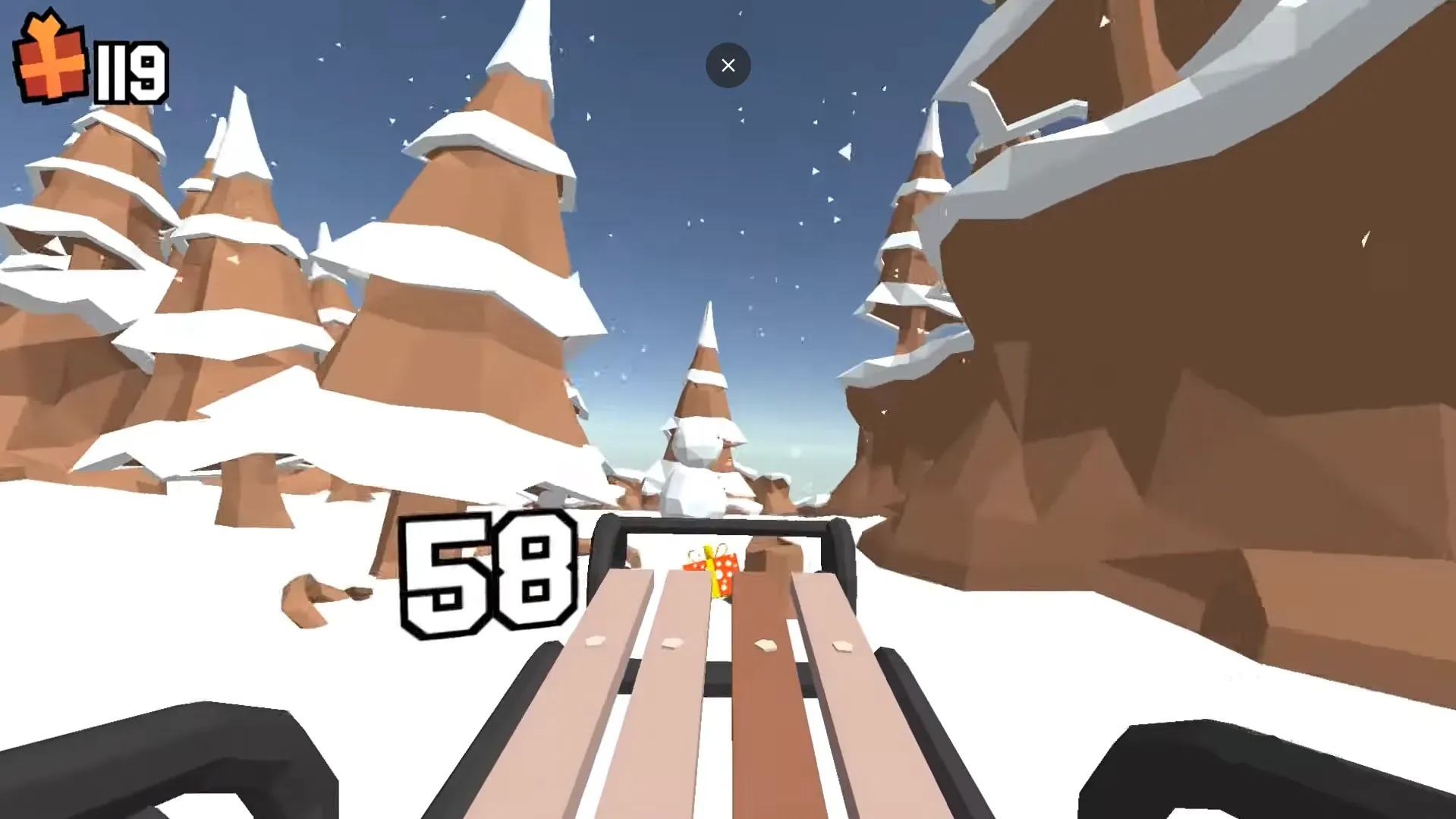Sleigh mid-jump above a cluster of pine trees in Snow Rider 3D